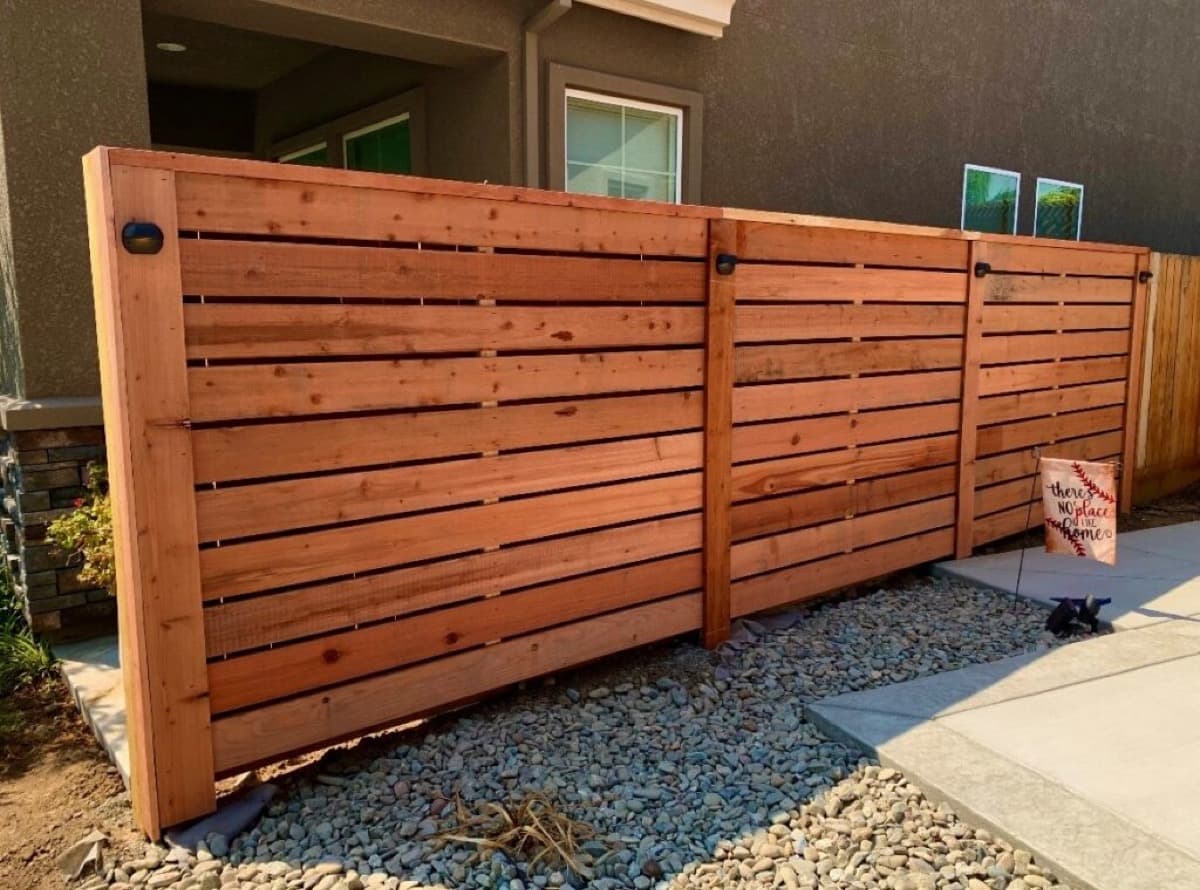 Redwood fence after professional staining and sealing — EVN Handyman Portland & Vancouver WA