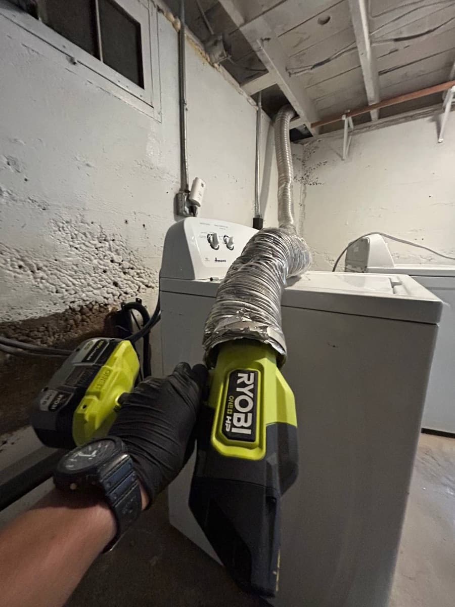 Cleaning a basement dryer vent duct with a blower Gresham — EVN Handyman